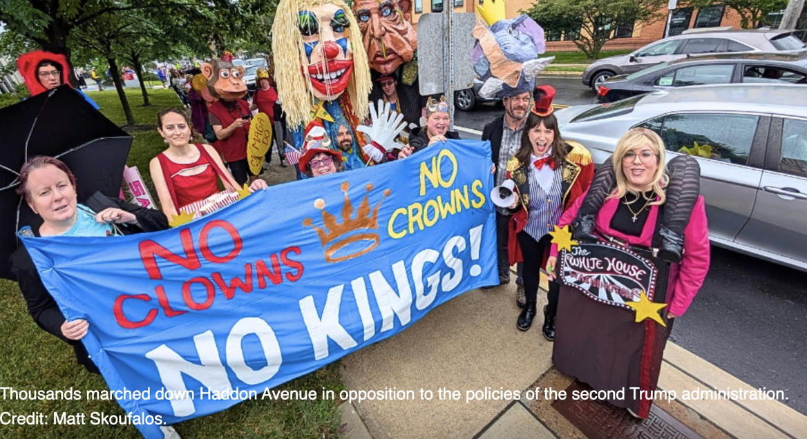 The members of CRI Creative pose for a picture on Haddon Ave during the No Kings Rally.