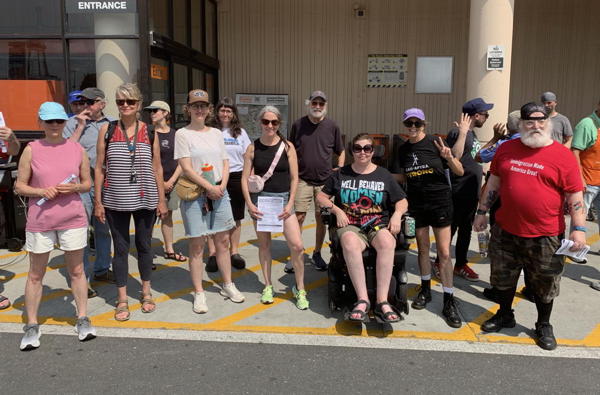 A group of about 15 people stand out in front of the Home Depot in South Philly