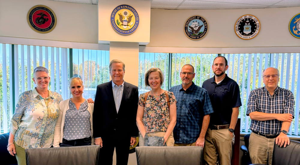 A small team from CRI in a picture with Congressperson Norcross.