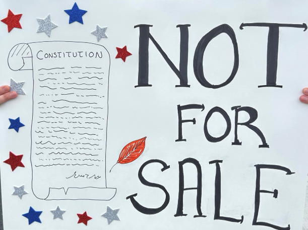 A sign from the protest. It says Not for Sale and it shows the US constitution