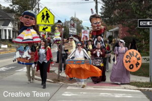 The Creative Team is fully decked out walking down Haddon Ave