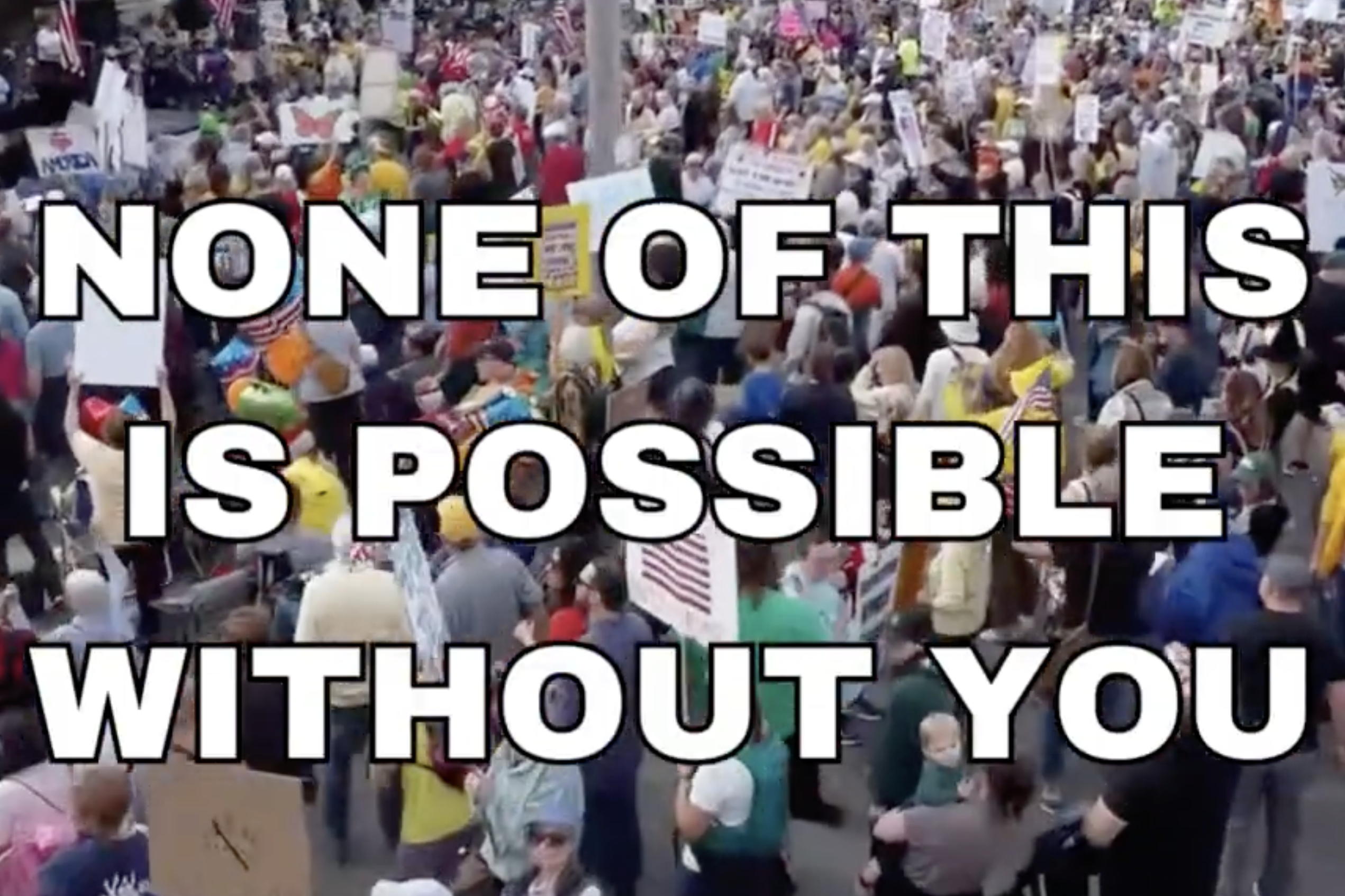 A drone shot looking down and a crowd that says "None of this is Possible without You"